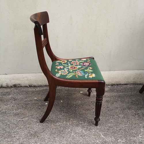 124 - A SET OF SIX MAHOGANY EARLY VICTORIAN DINING CHAIRS, each with curved back rest, which sits upon cur... 