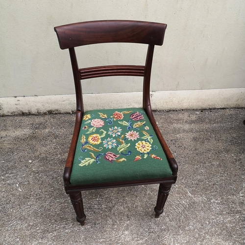 124 - A SET OF SIX MAHOGANY EARLY VICTORIAN DINING CHAIRS, each with curved back rest, which sits upon cur... 