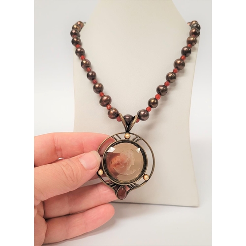 129 - AN EXTASIA GERMAN GLASS INTAGLIO NECKLACE, the pendant with light brown glass intaglio to the centre... 