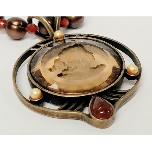 129 - AN EXTASIA GERMAN GLASS INTAGLIO NECKLACE, the pendant with light brown glass intaglio to the centre... 