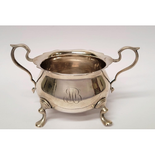 131 - A STERLING SILVER SUGAR BOWL & NIPS, the bowl with a pair of scrolling handles and scallop rim, rais... 