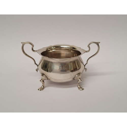 131 - A STERLING SILVER SUGAR BOWL & NIPS, the bowl with a pair of scrolling handles and scallop rim, rais... 