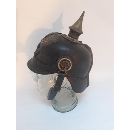 134 - A GERMAN WORLD WALL I PICKELHAUBE BONNET / HELMET, also known as a pickelhelm, the helmet has a spik... 