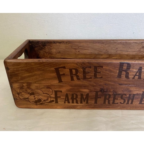 138 - A PINE EGG HOLDER BOX, with ‘Free Range Farm Fresh Eggs’ text to the front and egg illustrations, to... 