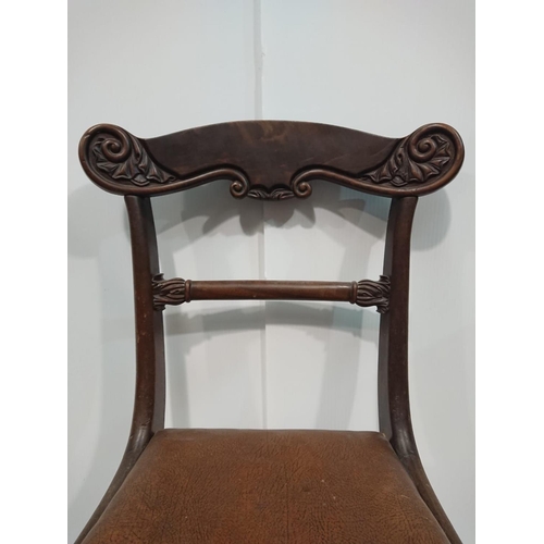 144 - AN EDWARDIAN MAHOGANY DINING CHAIR with rosewood veneer on top-rail, with each shoulder terminating ... 