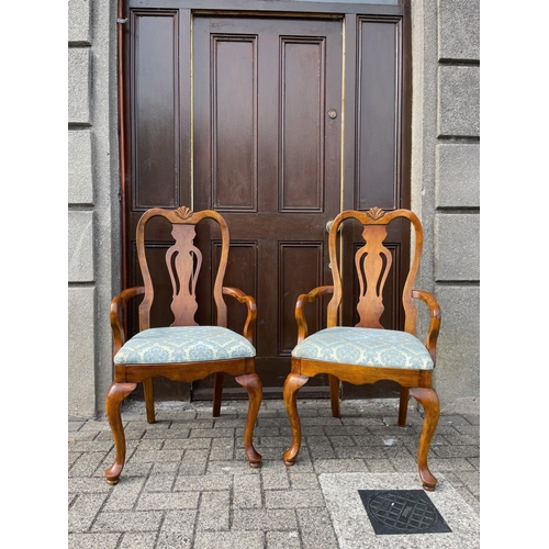 17 - A VERY FINE PAIR OF WALNUT GEORGE II STYLE ARMCHAIRS, each with curved crest rail having a central c... 