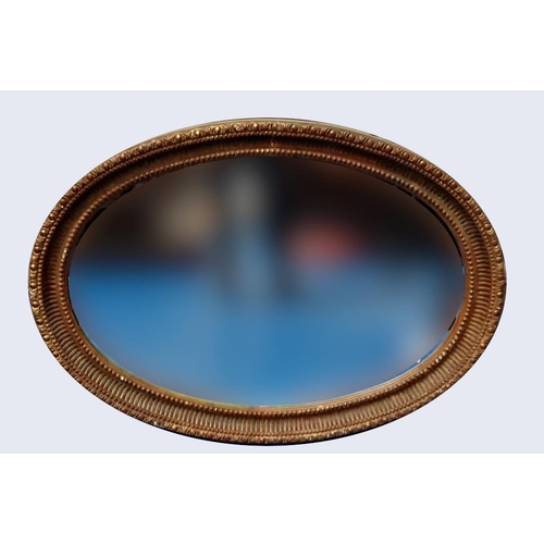 173 - A VERY GOOD QUALITY GILT OVAL SHAPED WALL MIRROR, would work well in a hallway, or over a mantle pla... 