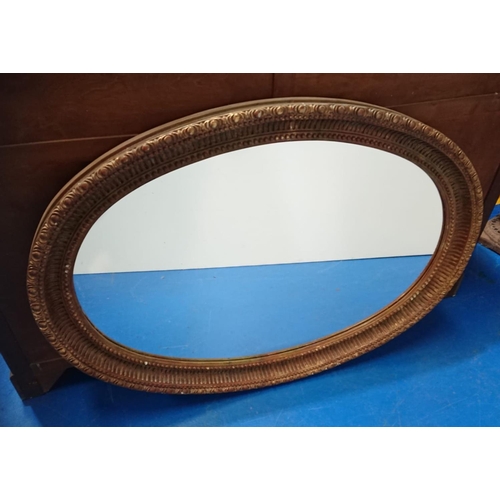 173 - A VERY GOOD QUALITY GILT OVAL SHAPED WALL MIRROR, would work well in a hallway, or over a mantle pla... 