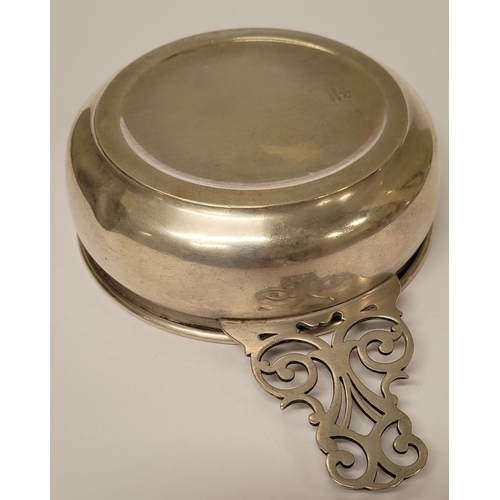 185 - A STERLING SILVER PORRINGER BOWL, with pierced handle decorated with scroll design. Marked Sterling ... 