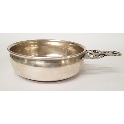 185 - A STERLING SILVER PORRINGER BOWL, with pierced handle decorated with scroll design. Marked Sterling ... 