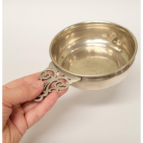 185 - A STERLING SILVER PORRINGER BOWL, with pierced handle decorated with scroll design. Marked Sterling ... 