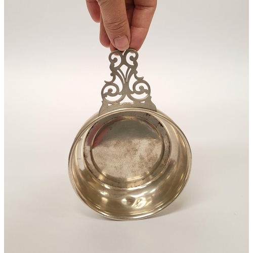 185 - A STERLING SILVER PORRINGER BOWL, with pierced handle decorated with scroll design. Marked Sterling ... 