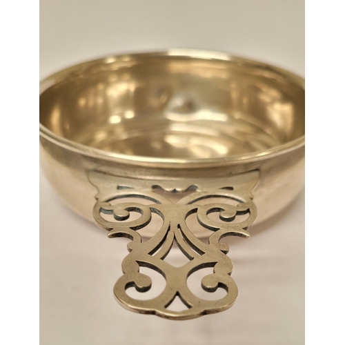 185 - A STERLING SILVER PORRINGER BOWL, with pierced handle decorated with scroll design. Marked Sterling ... 