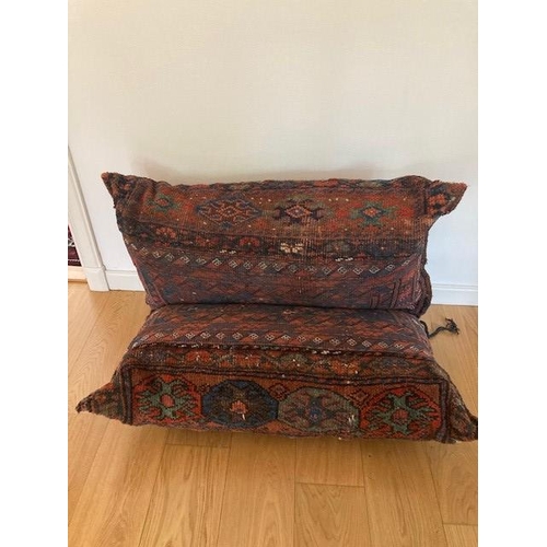 200 - A DOUBLE PERSIAN CUSHION, the cushions are tied together with each half measuring 110cm x 70cm, deco... 