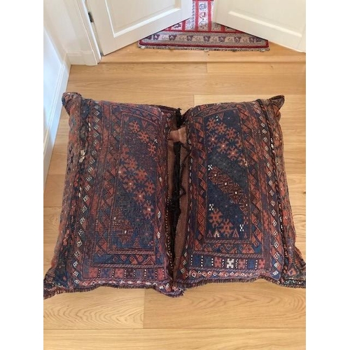 200 - A DOUBLE PERSIAN CUSHION, the cushions are tied together with each half measuring 110cm x 70cm, deco... 