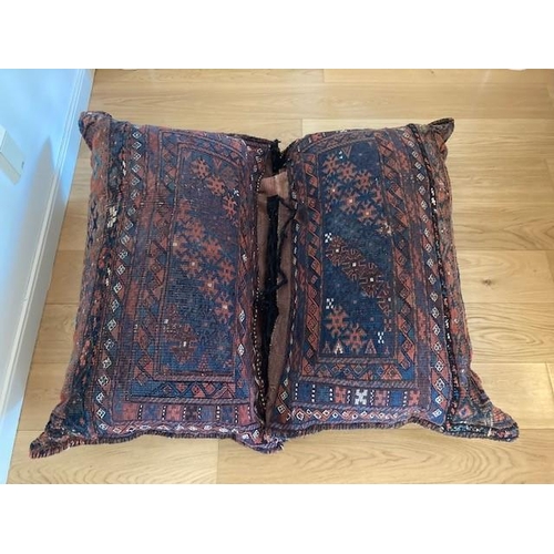 200 - A DOUBLE PERSIAN CUSHION, the cushions are tied together with each half measuring 110cm x 70cm, deco... 