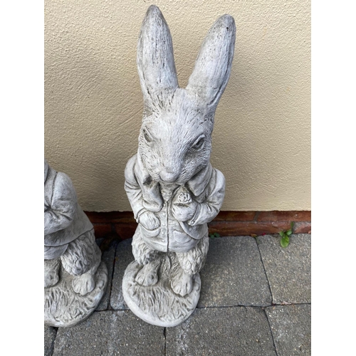 205 - A PAIR OF GARDEN ORNAMENTS IN THE FORM OF TWO RABBITS, 53cm tall each.