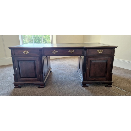 21 - A VERY FINE MAHOGANY LEATHER TOPPED PARTNERS DESK, the concave break front to the front and back add... 