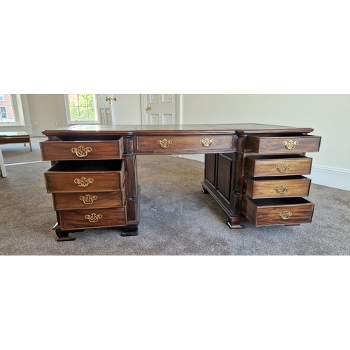 21 - A VERY FINE MAHOGANY LEATHER TOPPED PARTNERS DESK, the concave break front to the front and back add... 