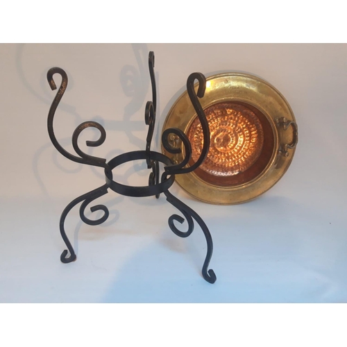 213 - AN UNUSUAL OLD COPPER & BRASS BRAZIER, with a wrought iron stand, 50cm tall x 40cm diameter.