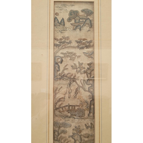 215 - AN ANTIQUE FRAMED CHINESE EMBROIDERY PANEL, showing figures within a river landscape, one upon a boa... 