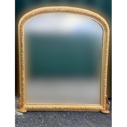 250 - A GOOD GILT OVERMANTLE MIRROR, of arched form, mirror within a finely carved frame with twisted flor... 