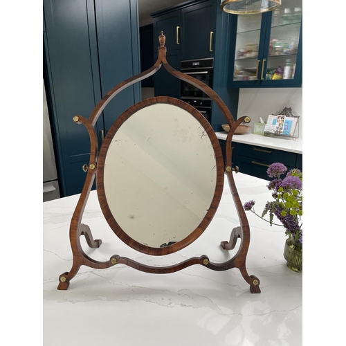 33 - A VERY FINE GEORGE III ROSEWOOD / MAHOGANY SKELETON DRESSING MIRROR, circa 1795, the oval shaped swi... 