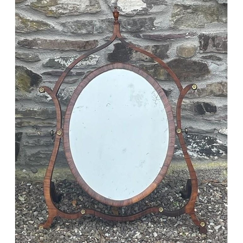 33 - A VERY FINE GEORGE III ROSEWOOD / MAHOGANY SKELETON DRESSING MIRROR, circa 1795, the oval shaped swi... 