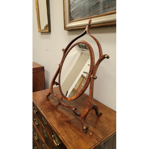 33 - A VERY FINE GEORGE III ROSEWOOD / MAHOGANY SKELETON DRESSING MIRROR, circa 1795, the oval shaped swi... 