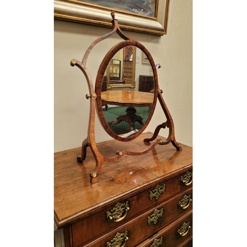 33 - A VERY FINE GEORGE III ROSEWOOD / MAHOGANY SKELETON DRESSING MIRROR, circa 1795, the oval shaped swi... 