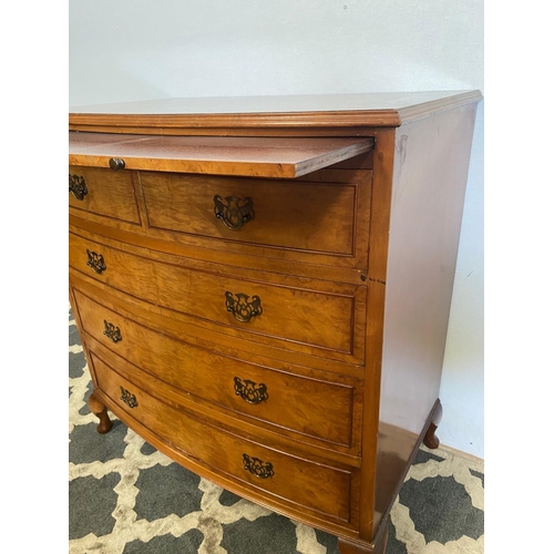 37 - A VERY GOOD BOW FRONTED FIGURED BURR WALNUT CHEST, with a narrow brush slide to the top over an arra... 