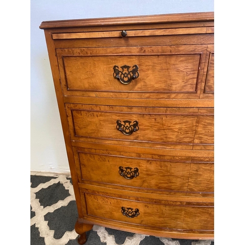 37 - A VERY GOOD BOW FRONTED FIGURED BURR WALNUT CHEST, with a narrow brush slide to the top over an arra... 