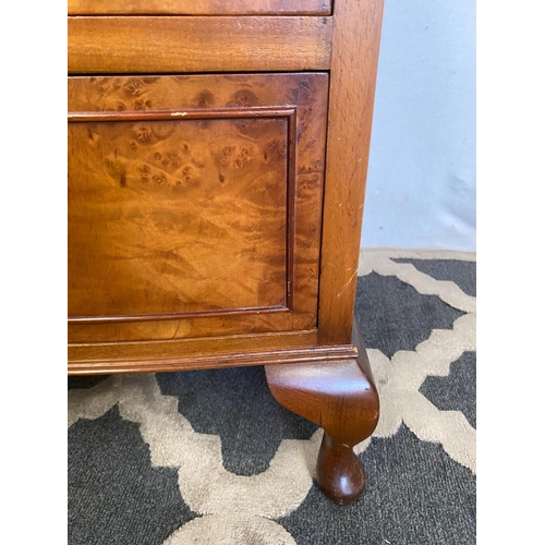 37 - A VERY GOOD BOW FRONTED FIGURED BURR WALNUT CHEST, with a narrow brush slide to the top over an arra... 