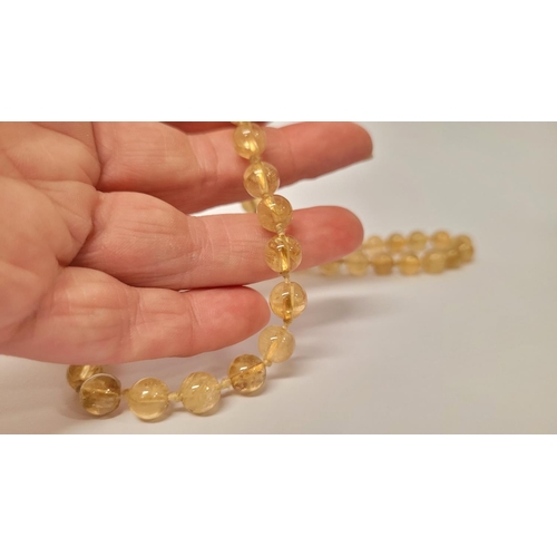 39 - A VERY PRETTY 9CT YELLOW GOLD & CRYSTAL BEAD NECKLACE, the clasp with scroll open work marked 375. T... 