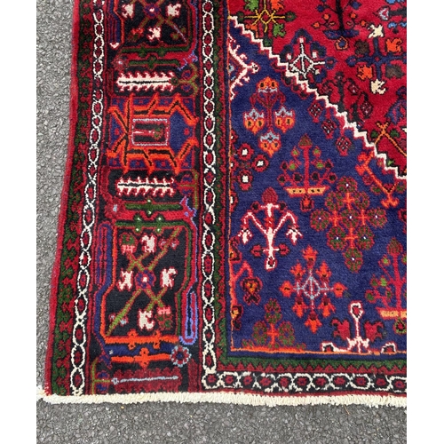 40 - A PERSIAN JOSHAGAN RUG, material: hand spun wool with natural organic dyes; design: this rug feature... 