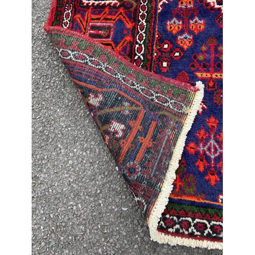 40 - A PERSIAN JOSHAGAN RUG, material: hand spun wool with natural organic dyes; design: this rug feature... 