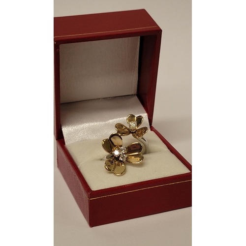 5 - A PRETTY DYNAMIC 9CT GOLD & DIAMOND DAISY RING, the ring has two daisies each with moving petals aro... 