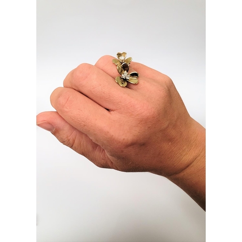 5 - A PRETTY DYNAMIC 9CT GOLD & DIAMOND DAISY RING, the ring has two daisies each with moving petals aro... 