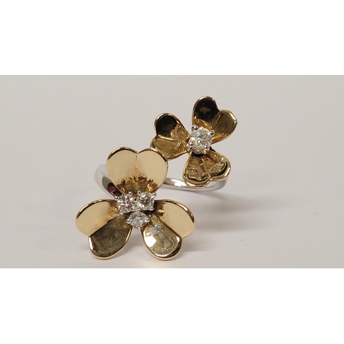 5 - A PRETTY DYNAMIC 9CT GOLD & DIAMOND DAISY RING, the ring has two daisies each with moving petals aro... 