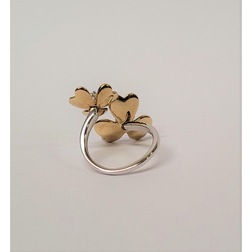 5 - A PRETTY DYNAMIC 9CT GOLD & DIAMOND DAISY RING, the ring has two daisies each with moving petals aro... 