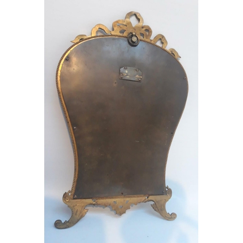 53 - A GOOD QUALITY 19TH CENTURY GILT BRASS MIRROR, with serpentine shape, decorated with a barley twist ... 