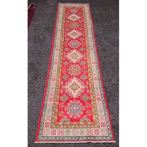 58 - A BEAUTIFUL AFGHAN KAZAK RUNNER RUG, material: hand spun wool with natural organic dyes; design: thi... 