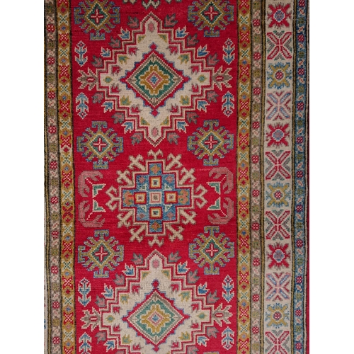 58 - A BEAUTIFUL AFGHAN KAZAK RUNNER RUG, material: hand spun wool with natural organic dyes; design: thi... 