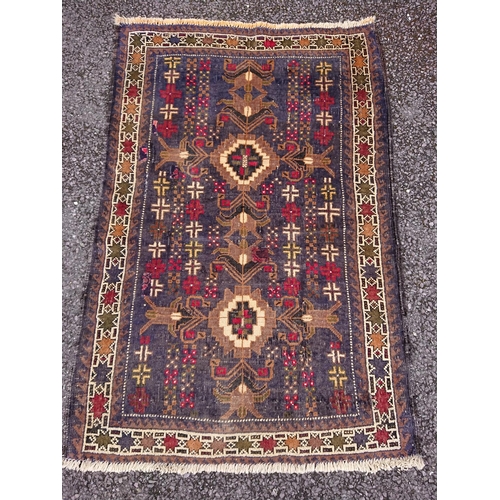 61 - A TRADITIONAL PERSIAN BELOUCH RUG, material: hand spun wool with natural organic dyes; design: this ... 