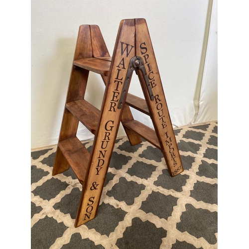 63 - A DECORATIVE PINE 3 STEP LADDER, decorated with wording down the sides ‘Walter Grundy & Son, Spice R... 