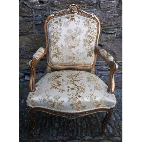 72 - AN ANTIQUE FRENCH GILTWOOD ARMCHAIR, with shell and scrolling floral detail to the crest rail, with ... 