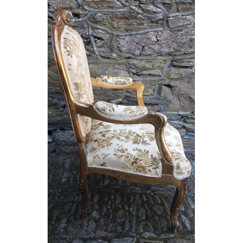 72 - AN ANTIQUE FRENCH GILTWOOD ARMCHAIR, with shell and scrolling floral detail to the crest rail, with ... 