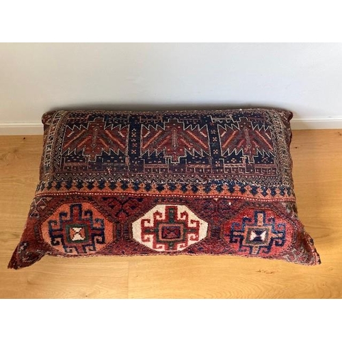 76 - A LARGE GOOD QUALITY PERSIAN RUG CUSHION, a handwoven cushion which was purchased by the current own... 