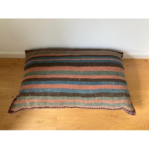 76 - A LARGE GOOD QUALITY PERSIAN RUG CUSHION, a handwoven cushion which was purchased by the current own... 