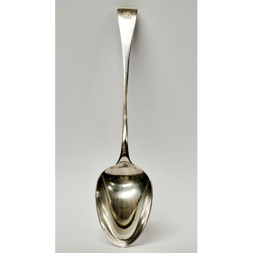 95 - A SOLID SILVER EARLY 20TH CENTURY SERVING SPOON, London hallmarks, date letter of ‘q’ for 1911. Make... 